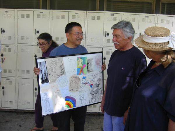 Wesley presenting the commemorative collage.